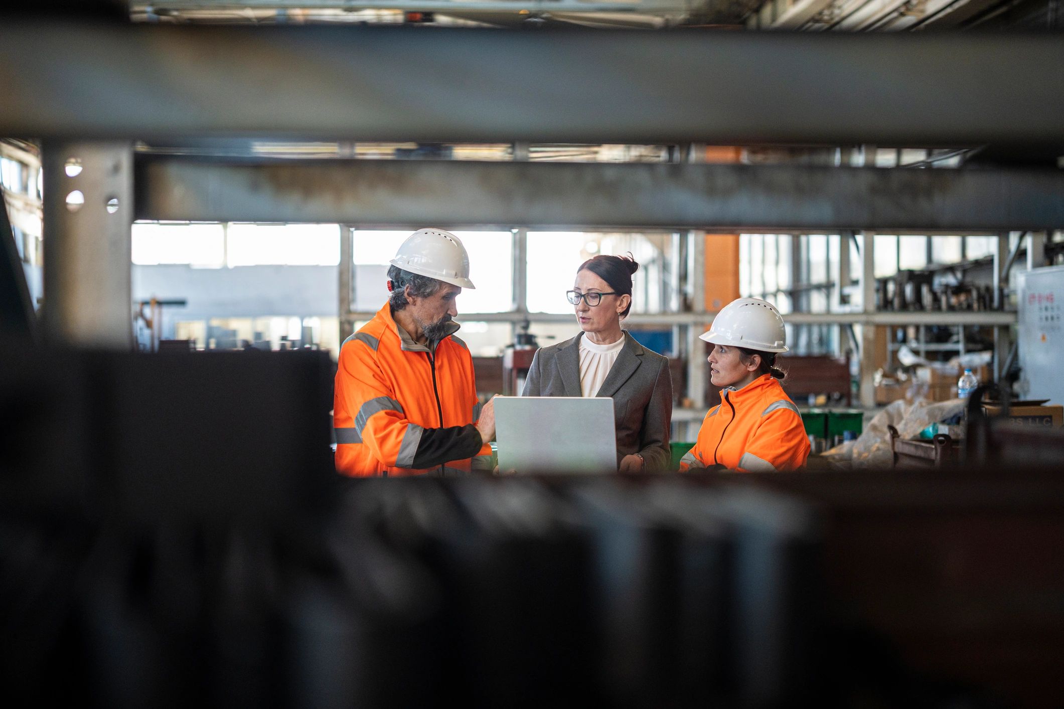Industrial team collaborating on factory operations